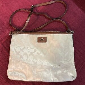 Coach crossbody. Tan fabric, brown leather straps.